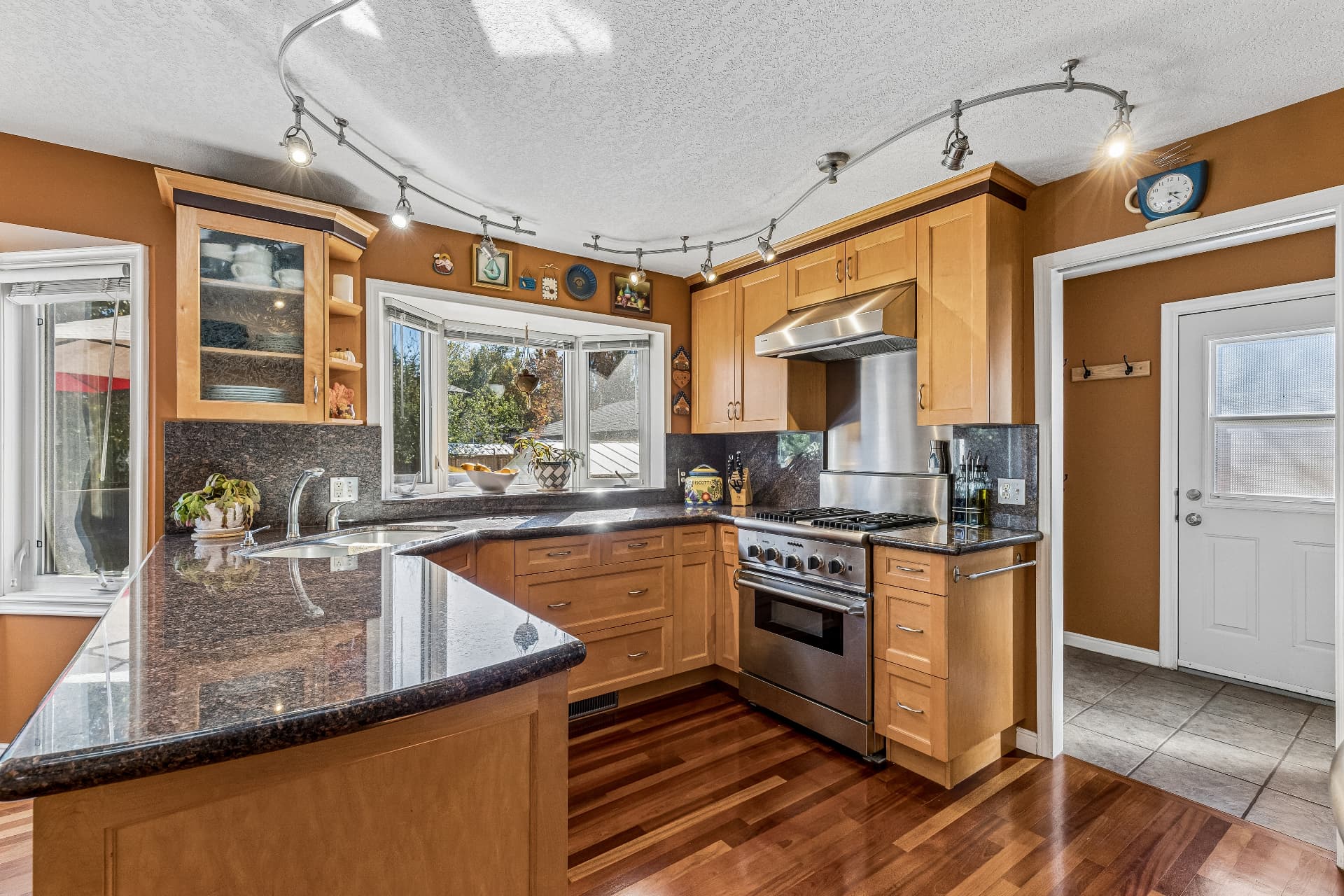 Updated kitchen — granite counters and maple cabinetry