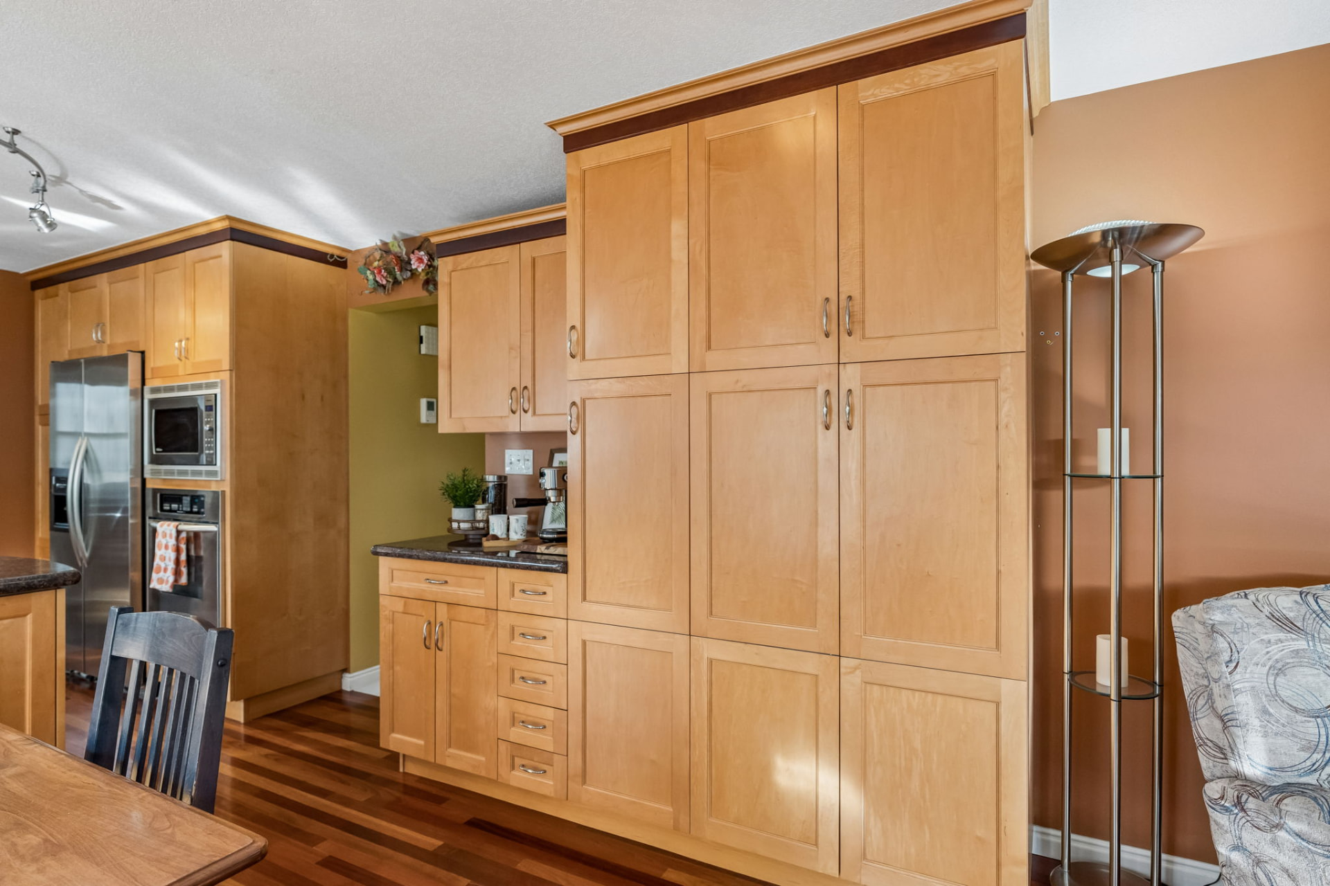 Built-in pantry with coffee station, custom sliding drawers and hidden pull-out recycling