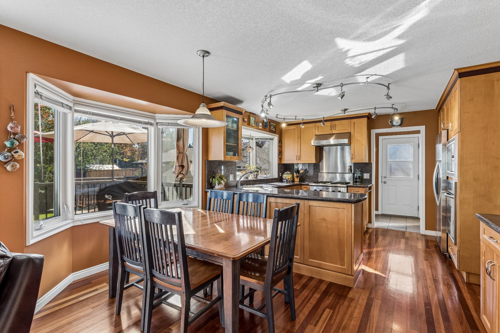 Granite counters, maple cabinetry and a professional dual fuel range