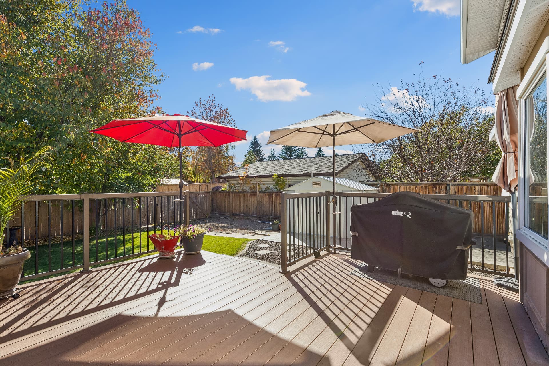 Deck view over the yard and deck umbrellas
